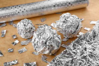 Crumpled balls and pieces of aluminium foil